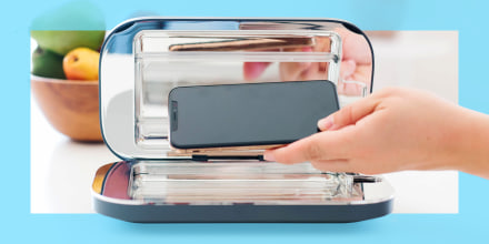PhoneSoap UV sanitizer on kitchen counter; The best smartphone and other tech UV sanitizers. Brands include PhoneSoap, LARQ, HoMedics and more