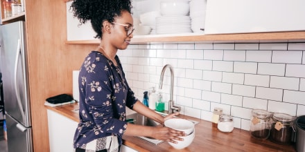 Woman organizing kitchen