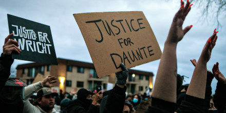Image: Protesters gather outside the Brooklyn Center Police Department calling for justice for Daunte Wright