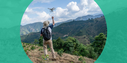 Man flying a drone in the countryside