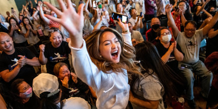 Image: Chyenne Lee celebrates after her sister Sunisa Lee won gold in the Women's All-Around gymnastics Final at the Tokyo Olympic Games at a watch party on July 29, 2021 in Oakdale, Minn.