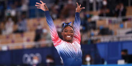 Simone Biles smiles after performing on the balance beam at the Tokyo Games on Aug. 3, 2021.