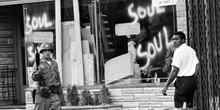 Image: A National Guard officer passes the smashed window of a black-owned flower shop in riot-torn Newark, N.J., on July 15, 1967.