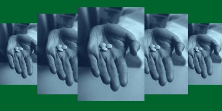 A repeating photo of a hand holding the RU-486 abortion pills.
