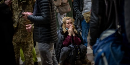 Image: A woman waits for a train as she tries to leave Kyiv, Ukraine on Feb. 24, 2022.