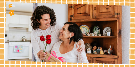 Latin young woman and her mother middle age with flowers and gift box at home celebrating Mother's Day