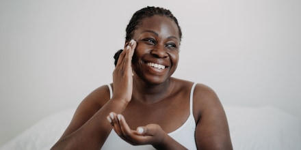 Skin care using cosmetic skin cream Woman with black skin