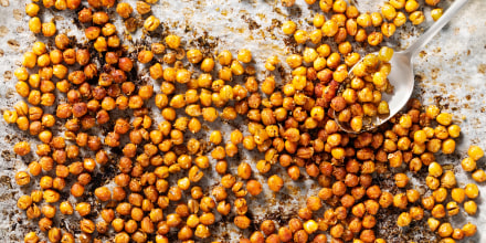 Tray of roasted or baked seasoned chickpeas.