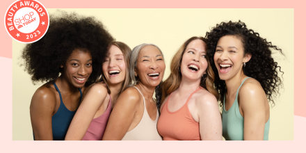 Group of women smiling and hugging