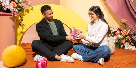 Couple sharing a gift with each other