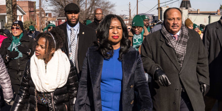 Dr. Martin Luther King, Jr.'s son, Martin Luther King III, his wife Arndrea Waters King and their daughter Yolanda Renee King walk along Martin Luther King Jr Ave SE during a Martin Luther King Jr. Day parade on Jan. 20, 2020 in Washington, DC.