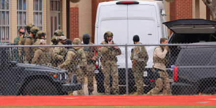 SWAT team members deploy near the Congregation Beth Israel Synagogue in Colleyville, Texas, some 25 miles west of Dallas, on January 15, 2022.