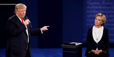 Image: Donald Trump speaks as Hillary Clinton listen during the town hall debate at at Washington University on Oct. 9, 2016 in St Louis, Missouri.