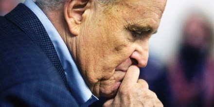 Former New York Mayor Rudy Giuliani pauses while addressing supporters of former President Donald Trump during a Columbus Day gathering at a Trump campaign field office in Philadelphia on October 12, 2020.