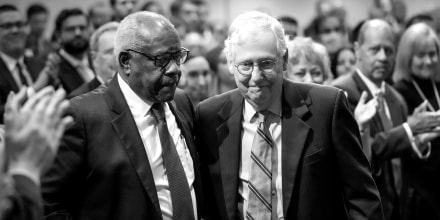 Image: Associate Supreme Court Justice Clarence Thomas looks on as Senate Minority Leader Mitch McConnell takes to the stage to speak.