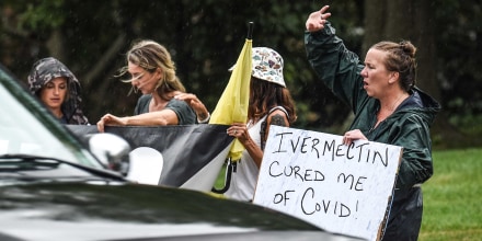 Protesters gather across the street from the Hamilton County Public Health building in Cincinnati's Corryville neighborhood on Aug. 9, 2021.