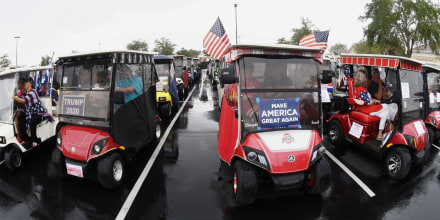 Backers of U.S. President Donald Trump line up for a golf