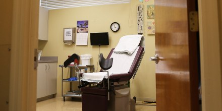 An examination room is seen at a women's reproductive health center