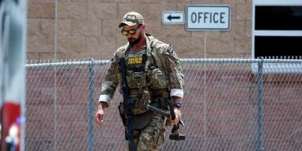 A Texas State Police officer walks outside Robb Elementary School following a shooting, in Uvalde, Texas, on May 24, 2022.
