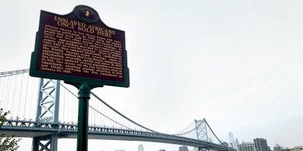 A marker reads "Enslaved Africans once sold here," commemorating a site where slaves were bought and sold on the Camden, N.J.,  waterfront in 2020.