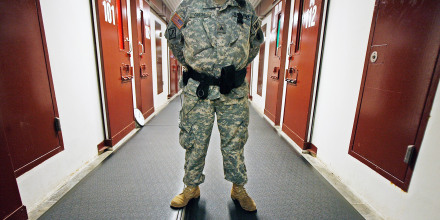 Image: A U.S. Army guard stands ready inside Camp 5 in the detention facility at the U.S. Naval Station in Guantanamo Bay, Cuba,