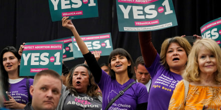 Supporters of the YES on Proposition 1 hold a rally at Long Beach City College in Long Beach, Calif., on Nov. 6, 2022. 