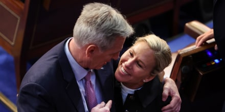 House Republican leader Kevin McCarthy embraces Rep.-elect Majorie Taylor Greene in the House Chamber during the fourth day of elections for Speaker of the House on Jan. 6, 2023.