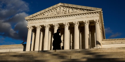 A police officer walks in front of the Supreme Court in Washington, D.C.