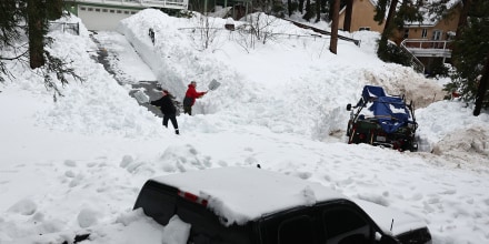 CRESTLINE, CALIFORNIA - MARCH 06: Residents attempt to shovel out their driveway after a series of winter storms in the San Bernardino Mountains in Southern California on March 6, 2023 in Crestline, California. Some residents have been stranded in Crestline close to two weeks due to the snowfall while the local grocery store was severely damaged when its roof collapsed under the weight of the snow. California Governor Gavin Newsom has declared a state of emergency due to winter storms for 13 counties including San Bernardino County and the California National Guard is assisting relief efforts in the mountains. (Photo by Mario Tama/Getty Images)