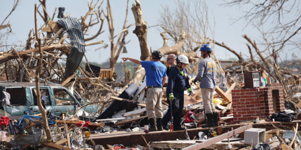 Search and rescue team members continue to look for tornado victims in Rolling Fork, Miss.