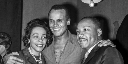 Harry Belafonte with Coretta Scott King and Martin Luther King Jr. during a meeting of the "Movement for the Peace" at the Palais des Sports in Paris on March 28, 1966.