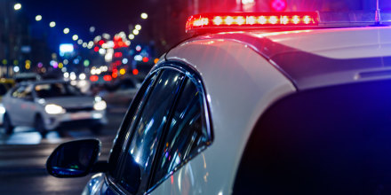 police car lights in night city with selective focus and bokeh