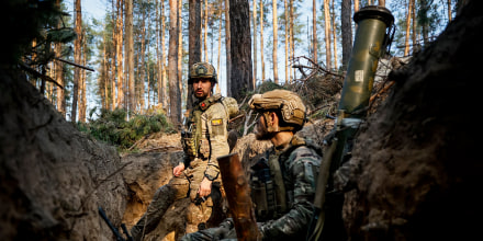 Ukrainian soldiers rest in a trench on the frontline near Kreminna, Luhansk region, on June 8, 2023.