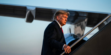 Former President Donald Trump boards his airplane after speaking at a campaign event on April 27, 2023, in Manchester, NH.