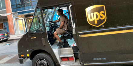 A United Parcel Service driver pilots his truck, in New York, Thursday, May 11, 2023. More than 340,000 unionized United Parcel Service employees, including drivers and warehouse workers, say they are prepared to strike if the company does not meet their demands before the end of the current contract on July 31. UPS