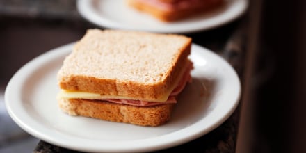 A simple sandwich on white plate.