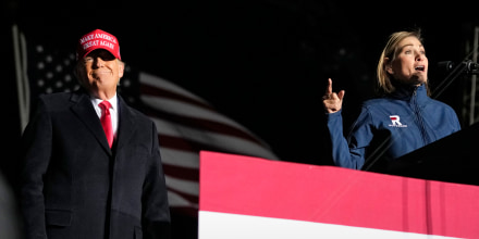 Former President Donald Trump and Iowa Gov. Kim Reynolds at a rally on Nov. 3, 2022, in Sioux City.