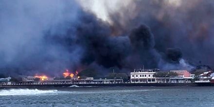 In this photo provided by Brantin Stevens smoke fill the air from wild fires at Lahaina harbor on Tuesday, Aug. 8, 2023 in Hawaii. Fire was widespread in Lahaina Town, including on Front Street, a popular shopping and dining area, County of Maui spokesperson Mahina Martin said by phone early Wednesday. Traffic has been very heavy as people try to evacuate the area, and officials asked people who weren’t in an evacuation area to shelter in place to avoid adding to the traffic, she said.