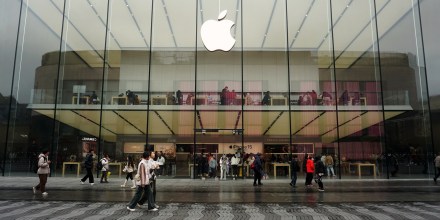 People walk past an Apple flagship store in Hangzhou, China
