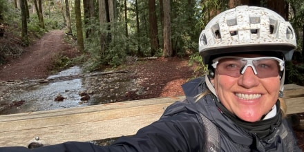 selfie of Kirsten Stein biking.