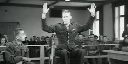 An American survivor of the Malmedy Massacre testifies in a war crimes trial in Dachau, Germany, May 20, 1946.