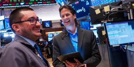 Traders smile as they work