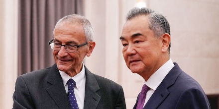 US White House senior adviser and climate envoy John Podesta (L) shakes hands with China's Foreign Minister Wang Yi at the Great Hall of the People in Beijing on September 6, 2024.