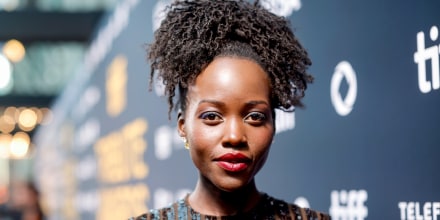 Lupita Nyong'o stands for a portrait on the red carpet