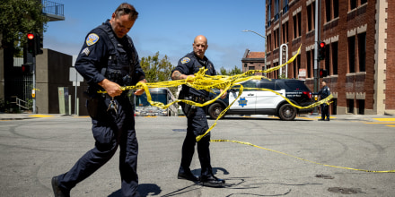 San Francisco Police Department officers remove tape at the scene of a shooting that left one high school student injured on Aug. 21, 2024.