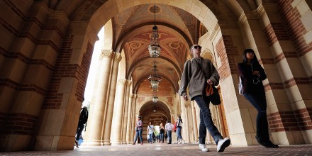 Students walk near Royce Hall on the campus of UCLA.