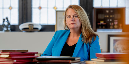 Jessie Hoerman sits with Marine Corps cruise and graduation books at her home in Clayton, Mo.