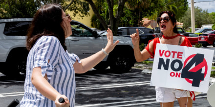 Two women argue at Harris Campaign Reproductive Rights Bus Tour stop