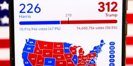 A graphic with the final US presidential results is screened on a mobile phone