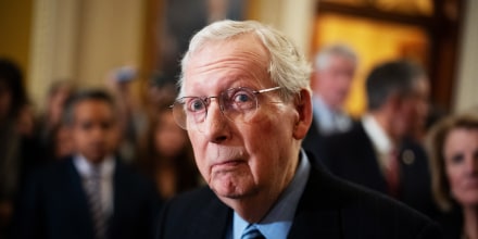 Mitch McConnell takes a question from a reporter during a news conference